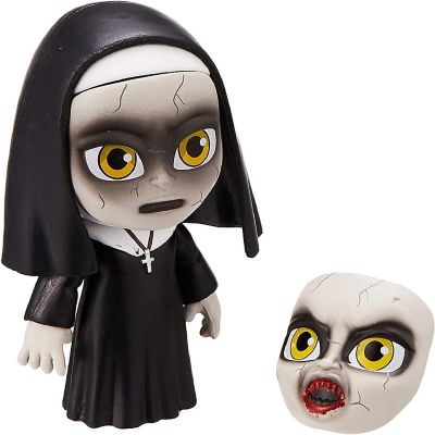 Toy figure of a nun with a detachable mask on a white background