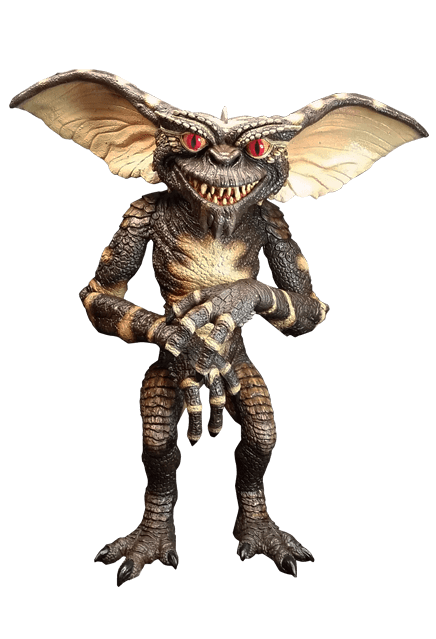 This is a Gremlins evil gremlin puppet prop, who is standing and he is green with big ears, spikes on his head and red eyes.