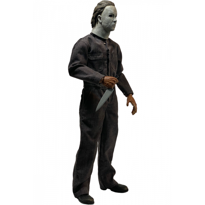 This is a Halloween 5 Revenge of Michael Myers Trick Or Treat Action Figure and he has a white mask, grey coveralls, black boots, burnt hand that are holding a silver knife.
