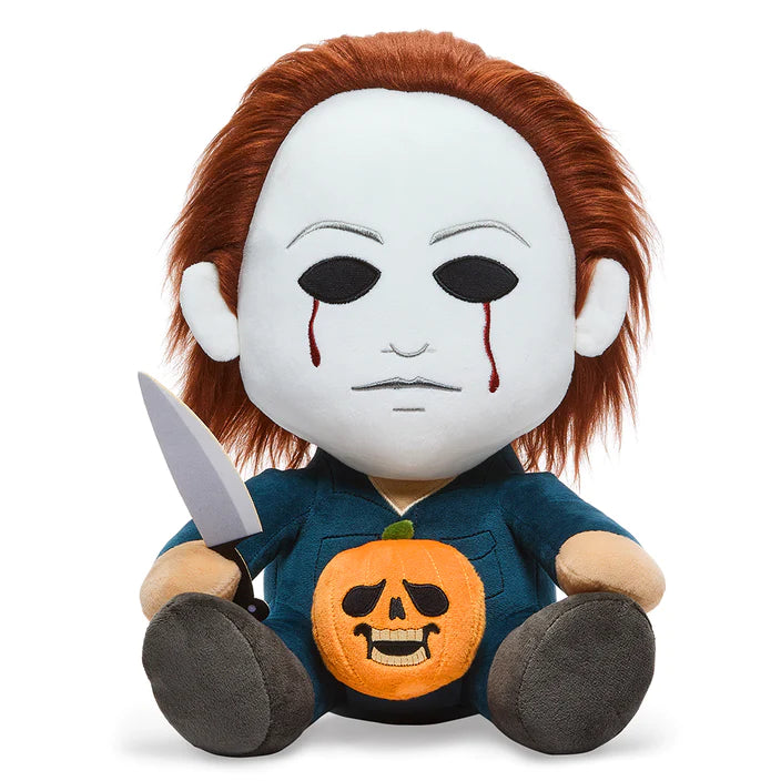 This is a Halloween movie Michael Myers Hugme Kidrobot plush and he has a white mask, brown hair, silver knife, blue coveralls, brown feet.