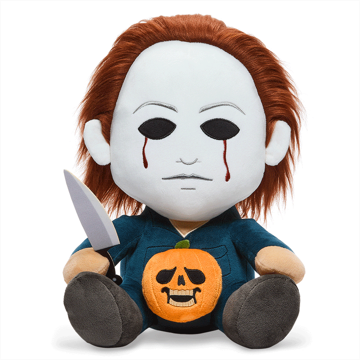 This is a Halloween movie Michael Myers Hugme Kidrobot plush and he has a white mask, brown hair, silver knife, blue coveralls and he is vibrating.