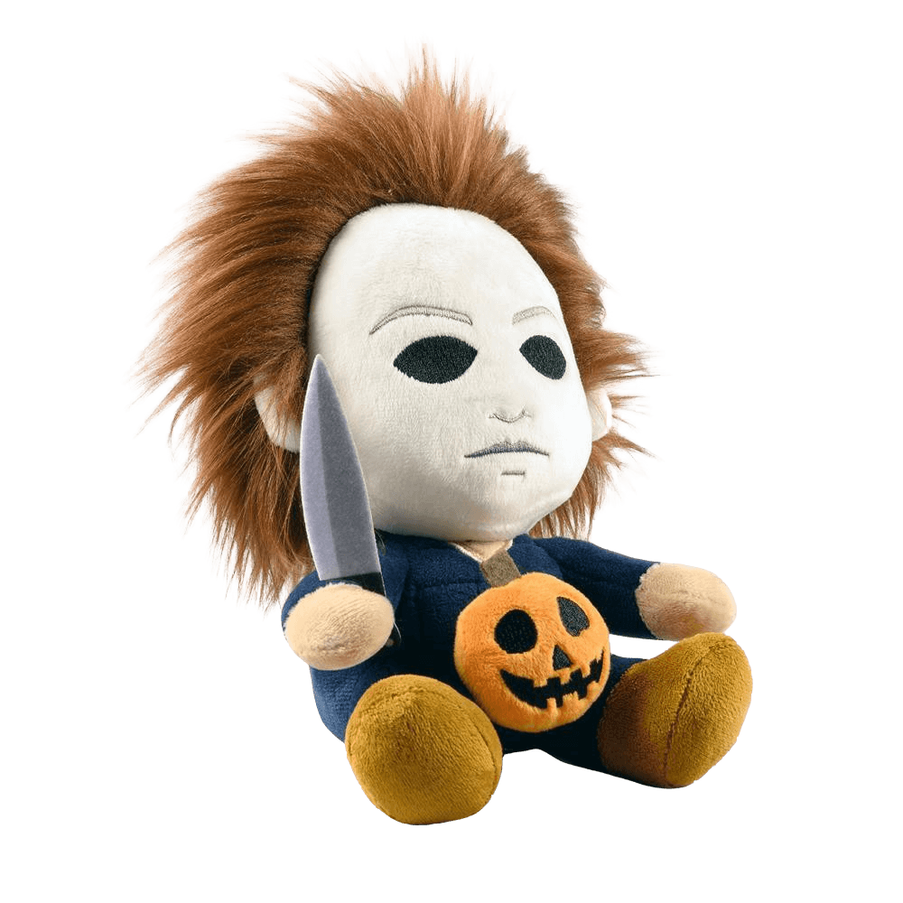 This is the side of a Kidrobot Halloween Michael Myers Phunny stuffed plush that has a white face, brown hair, blue coveralls, a silver knife and orange pumpkin.