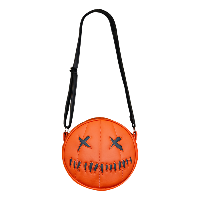 This is a Trick 'R Treat Sam pumpkin purse that is orange and has black eyes and mouth.