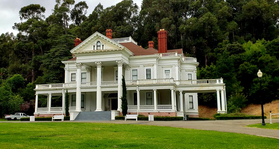 Large, white Dunsmuir House in Oakland Ca