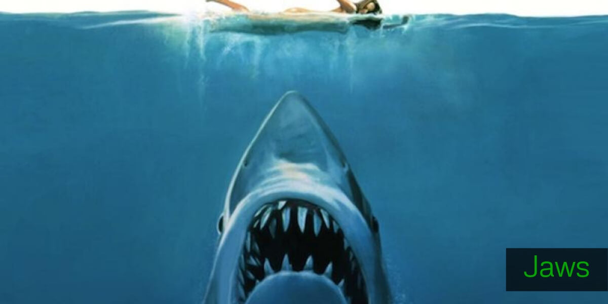 Jaws movie poster with great white shark swimming up to a girl in the ocean