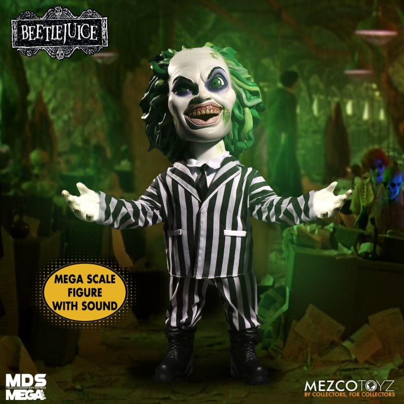 Talking Action figure of Beetlejuice with green hair and striped suit in a dark, eerie setting.