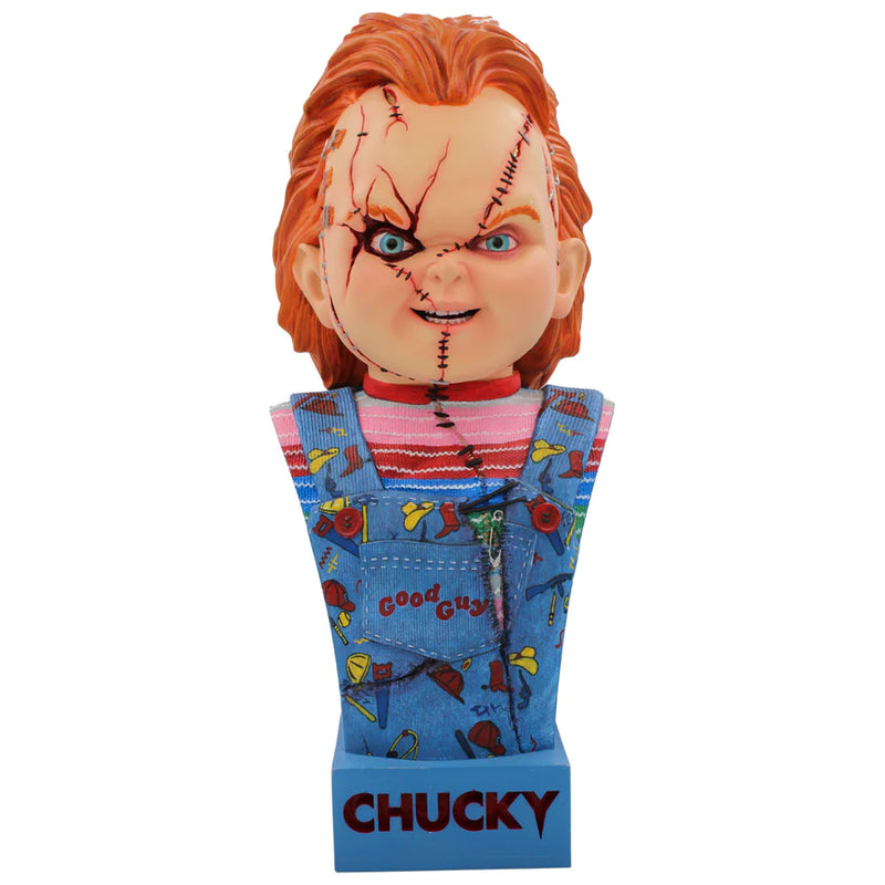 This is a Seed of Chucky 15" bust and he has orange hair, blue eyes, stiches, staples and scars on his face and he is wearing blue overalls and a striped shirt