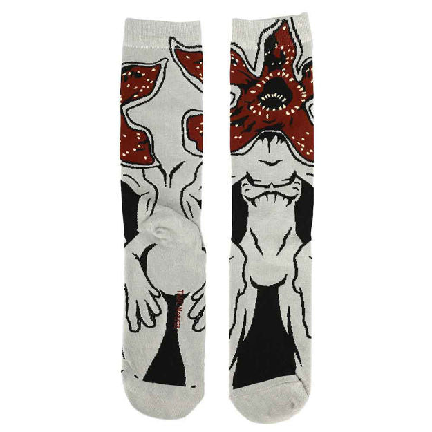 These are Stranger Thins demogorgon socks and they have a red and black monster with teeth on them and a black outline of their body