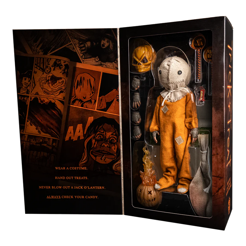 This is a Trick 'T Treat Sam 1:6 scale Figure box inside and he has a burlap mask, extra hands, lollipops, pumpkin, burlap bagand orange jumpsuit