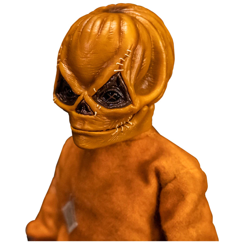 This is a Trick 'T Treat Sam 1:6 scale Figure and he has an unmasked face, and orange jumpsuit