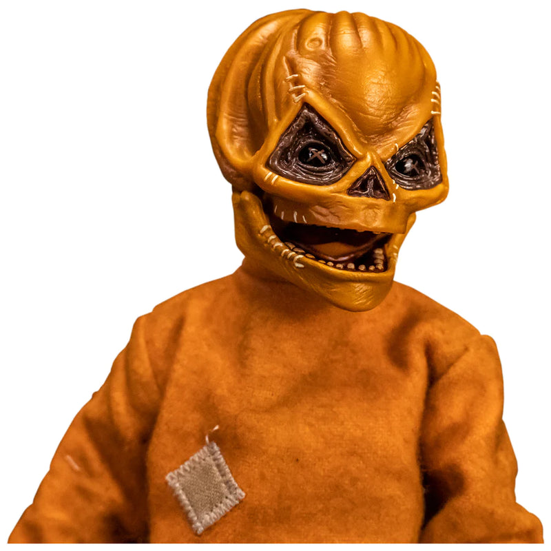 This is a Trick 'T Treat Sam 1:6 scale Figure and he has an unmasked face, and orange jumpsuit