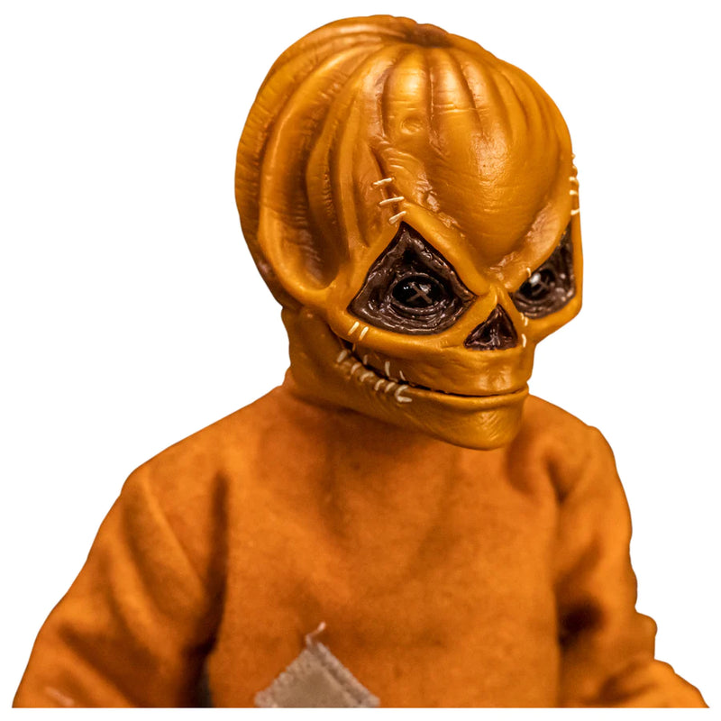 This is a Trick 'T Treat Sam 1:6 scale Figure and he has an unmasked face, and orange jumpsuit
