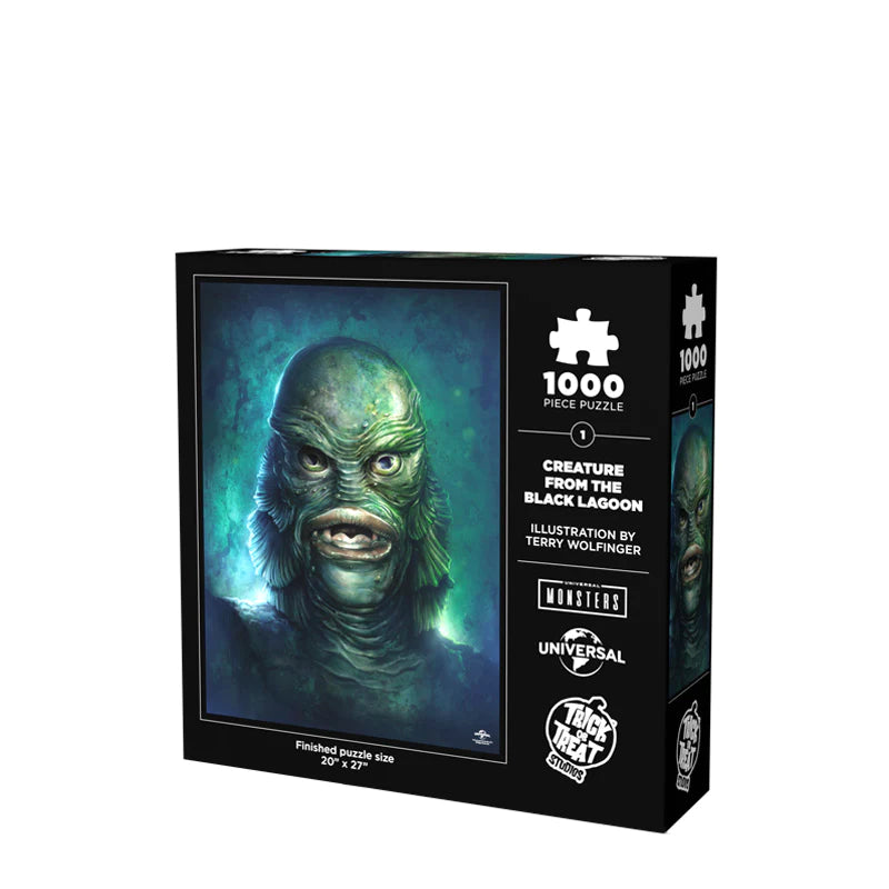 This is a Universal Monsters Puzzle of Creature From the Black Lagoon and he has a green face that looks like a fish, gills and teeth and it is the back of the box