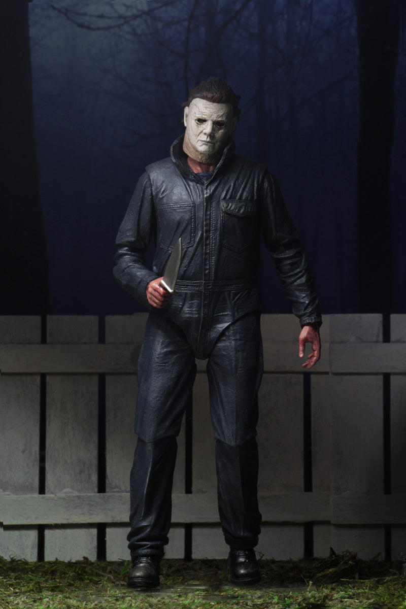 This is a Halloween 2018 Michael Myers NECA 7" ultimate action figure and he has a white mask, grey coveralls and black boots.