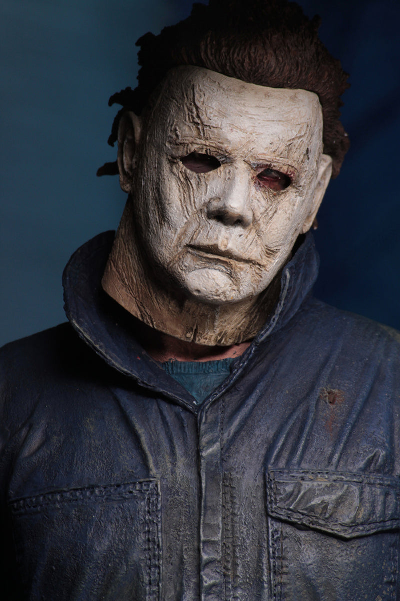 This is a Halloween 2018 Michael Myers NECA 7" ultimate action figure and he has a white mask and grey coveralls.