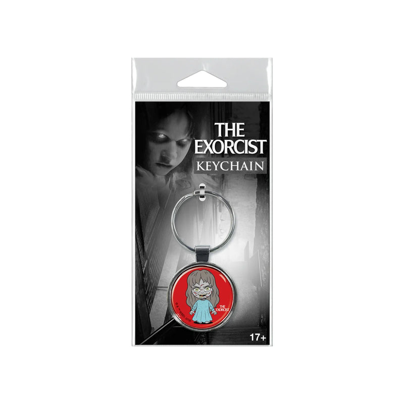 This is a keychain of Regan from The Exorcists and she is standing in a blue nightgown.