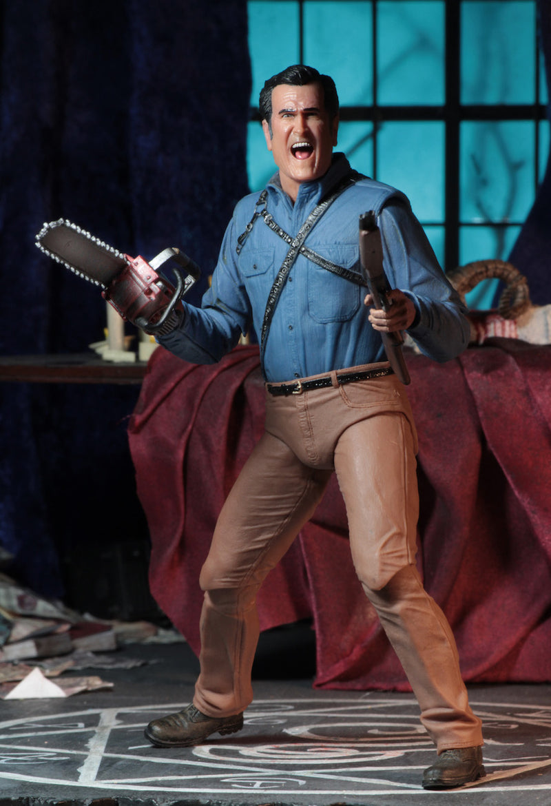 This is an Ash vs Evil Dead 7" Intimate NECA action figure with blue shirt, tan pants and he is holding a chainsaw and shotgun.