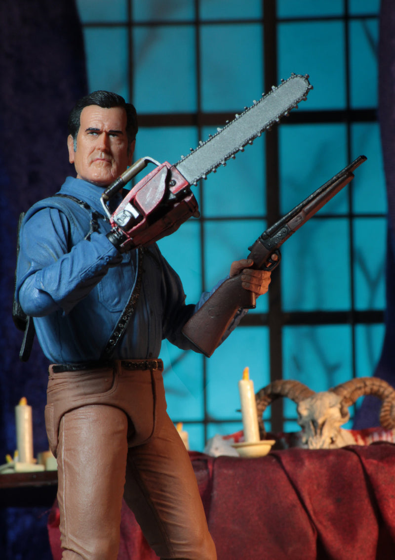 This is an Ash vs Evil Dead 7" Intimate NECA action figure with blue shirt, tan pants and he is holding a chainsaw and shotgun.