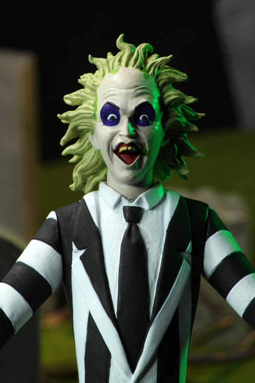 This is the Toony Terrors NECA action figure series 4 Beetlejuice and he has spiked green hair, open mouth and a striped suit.