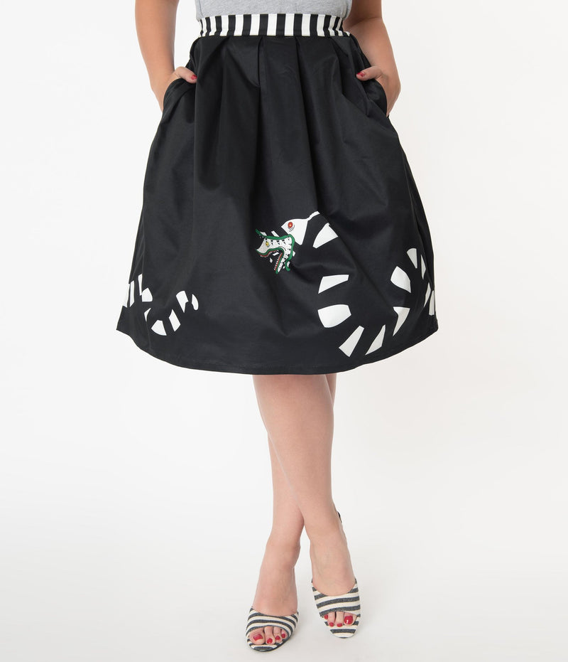 This is a Beetlejuice vintage pinup Sandworm swing skirt from Unique Vintage, that is black with a striped worm and the model is wearing a grey shirt and black and white striped shoes.