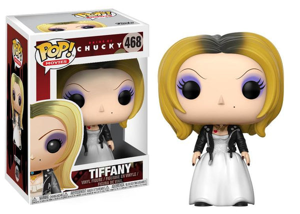 This is a Bride of Chucky Tiffany Pop Vinyl Funko and she is wearing a white dress, black leather jacket and shoes and she has blonde hair