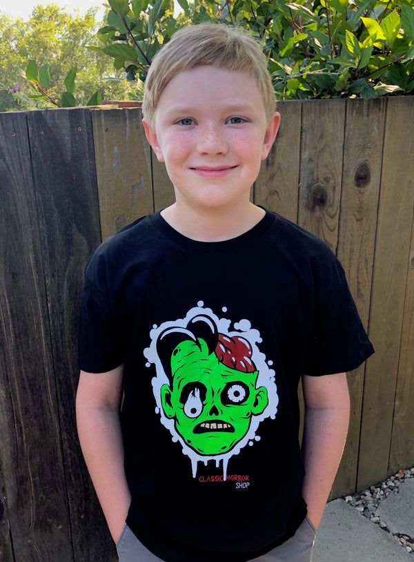Kid facing forward wearing a black Classic Horror T-shirt