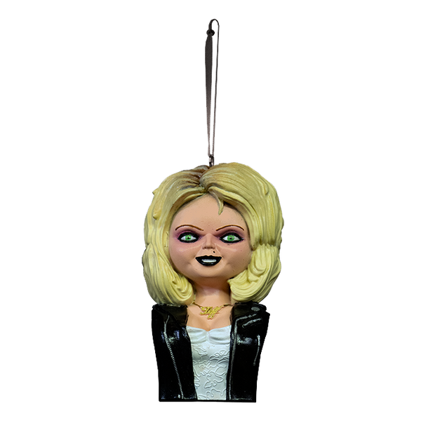 This is a Bride of Chucky Tiffany ornament and she has blonde hair, a gold necklace, a black leather jacket with zippers and a white dress 