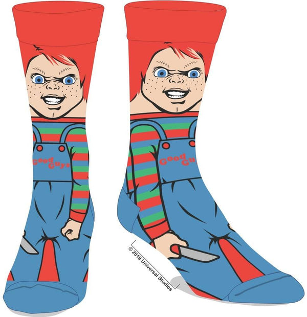 These are crew socks that are printed with Chucky from Child's Play and he has orange hair and striped overalls and he is holding a knife.
