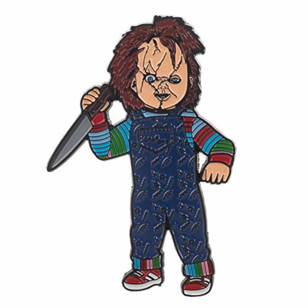 This is a Seed of Chucky enamel pin and he is wearing blue overalls and a striped shirt and holding a knife.