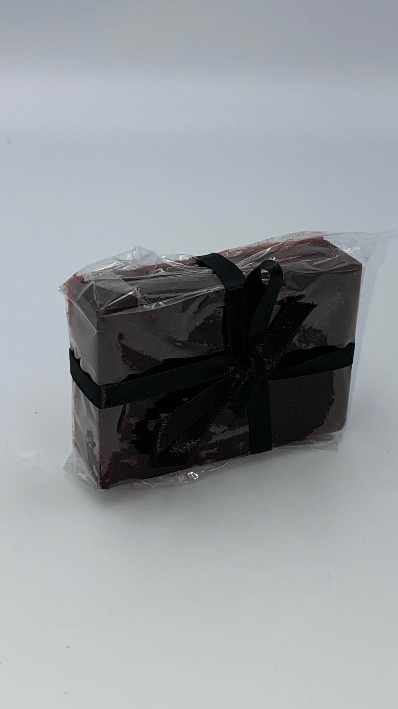 This is a dark blood red hemp bath soap in plastic, with a black ribbon.