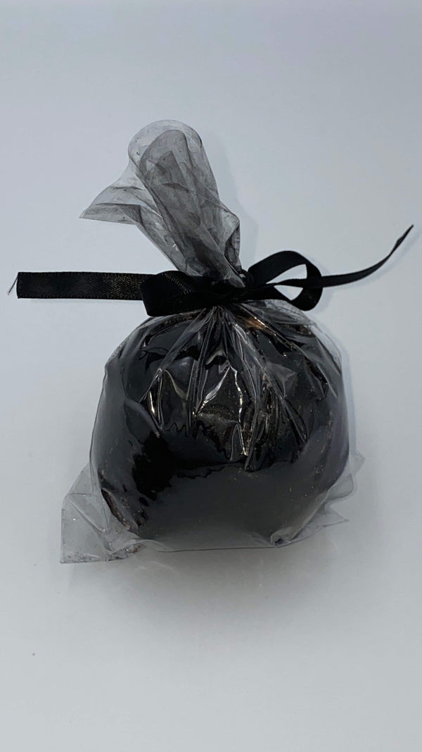 This is a black charcoal hemp bath bomb that is in plastic and closed with a black ribbon.