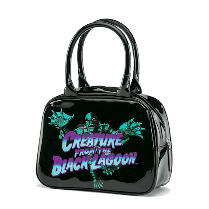 This is a universal monsters Creature From the Black Lagoon bowler handbag black purse that has blue and purple writing and a green monster.