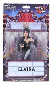 This is an Elvira NECA Toony Terror action figure and she is wearing a black dress, dagger knife and she has tall black hair and she is in a blister card package.