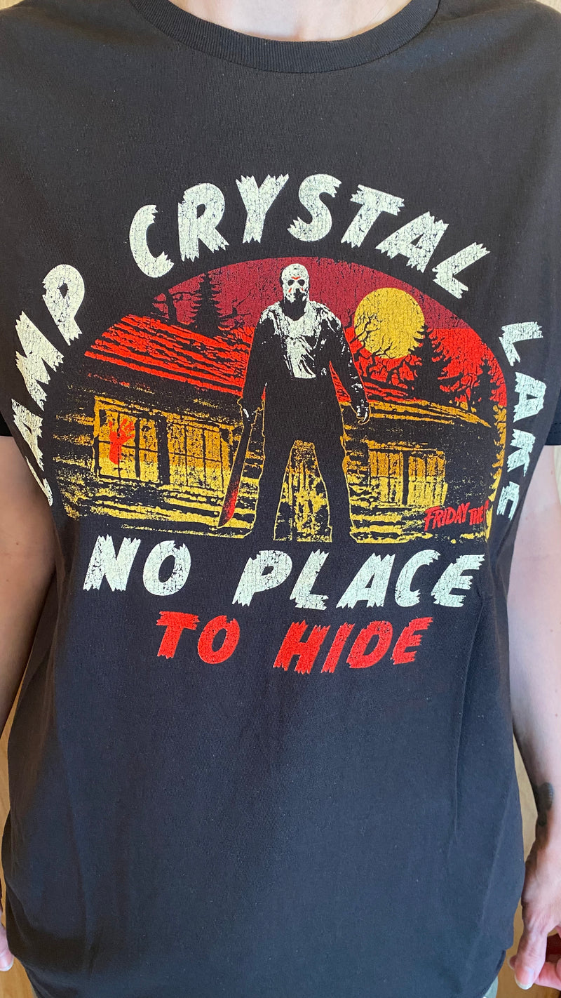 This is a black Friday the 13th Jason Voorhees no place to hide t-shirt that has a cabin, moon, trees and he is holding a machete.
