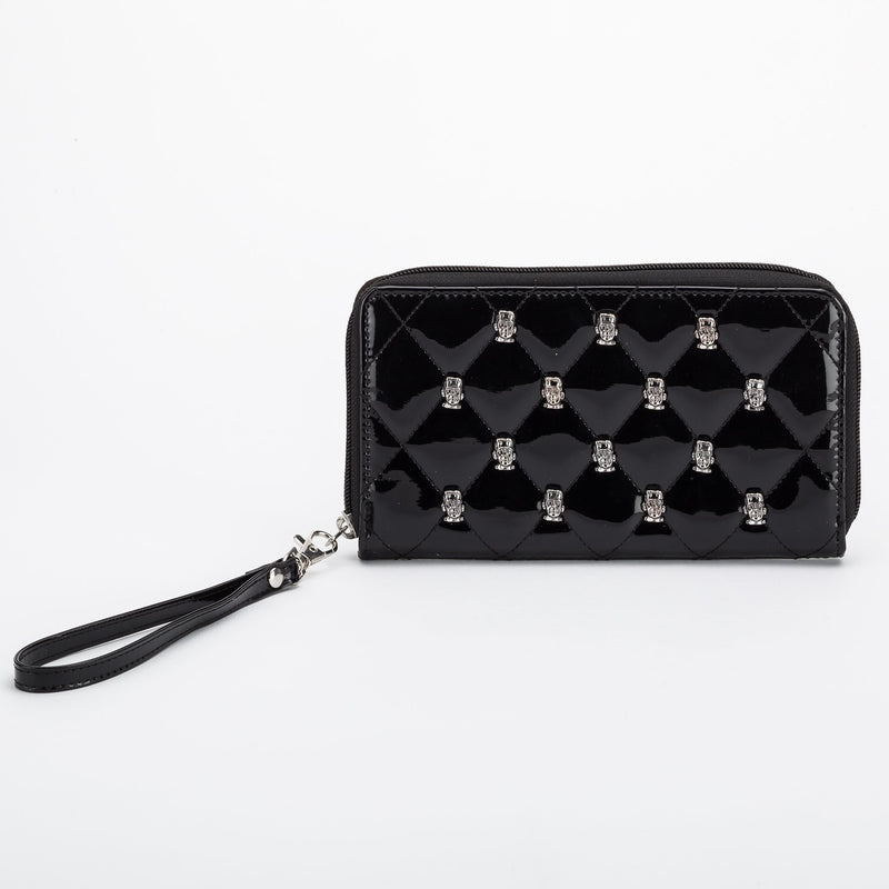 This is a vegan black Universal Monsters wallet that is shiny and has metal Frankenstein heads on it.