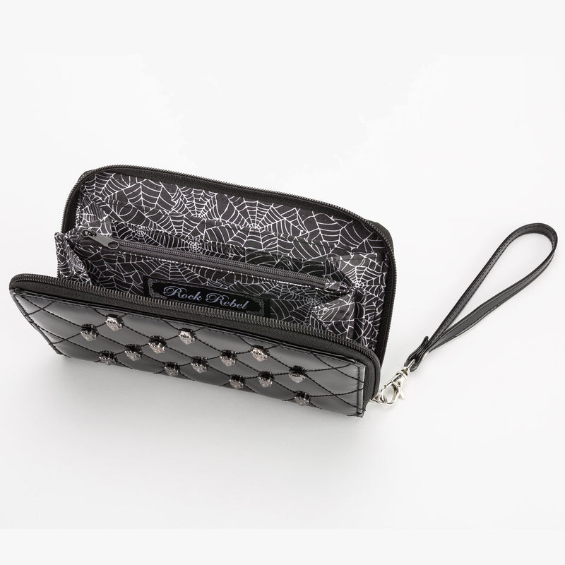 This is a vegan black Universal Monsters wallet that is shiny and has pockets inside.