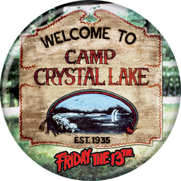 This is a Friday the 13th Camp Crystal Lake button and it is a brown welcome sign with the lake on it.