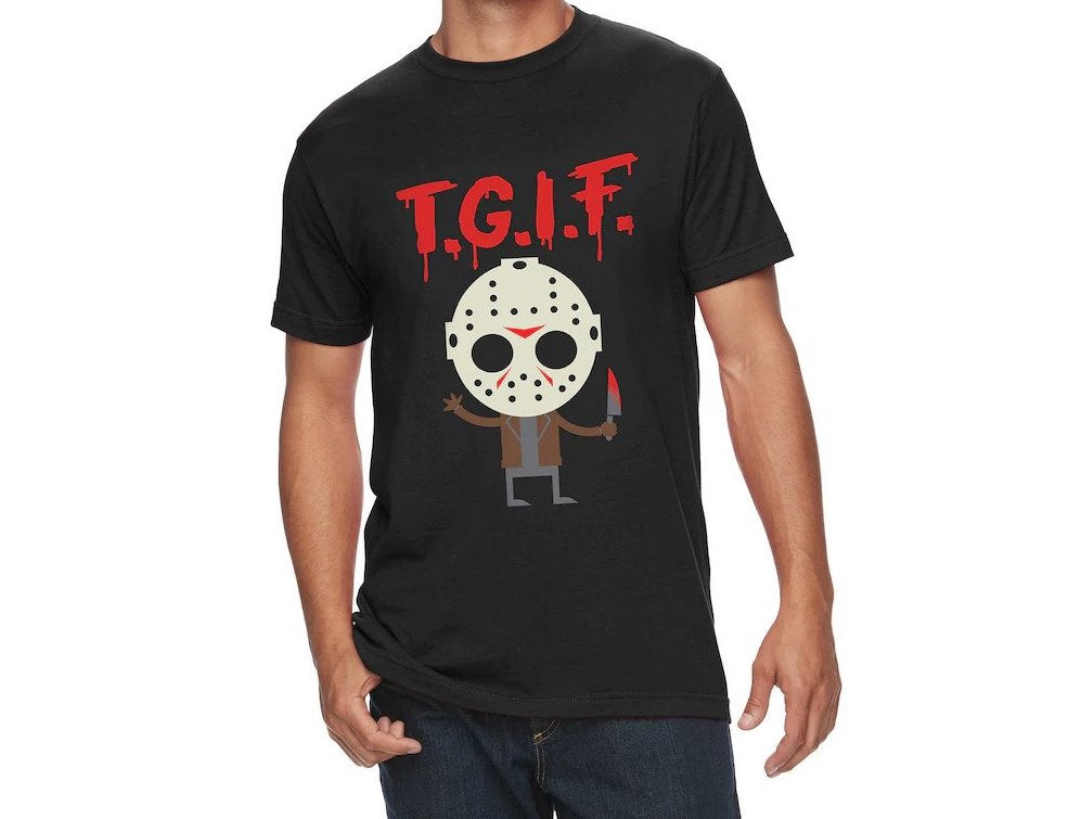 There is a guy wearing a men's black shirt, that has a cartoon picture of Jason Voorhees and says TGIF in red letters.