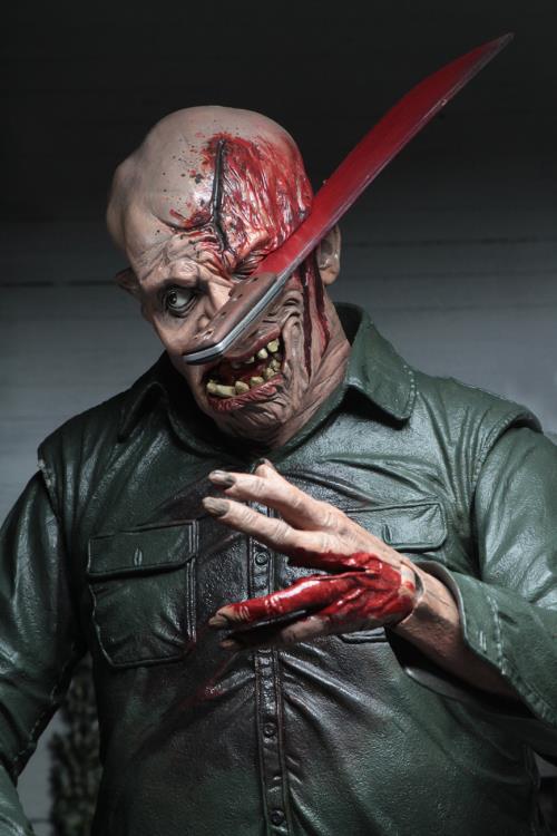 This is a NECA Jason Voorhees 1/4 scale action figure from Friday the 13th and he has a green button up shirt, bloody machete that is stuck in his head and eye.