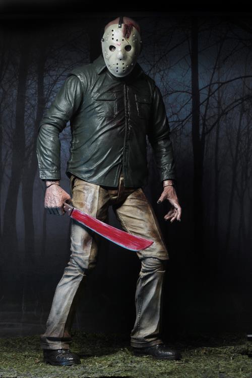 This is a NECA Jason Voorhees 1/4 scale action figure from Friday the 13th and he has a white hockey mask, green button up shirt, tan pants, black boots, bloody machete and he is in front of trees.