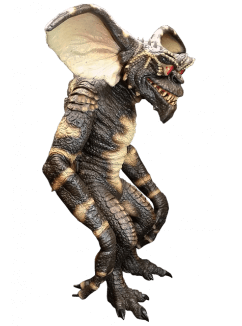 This is a Gremlins evil gremlin puppet prop, who is standing and he is green with big ears, spikes on his head, red eyes, sharp teeth and pointy feet.