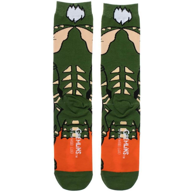 This is a pair of Gremlins Spike 360 printed socks and he is green with white spikey hair and spikes on his back.
