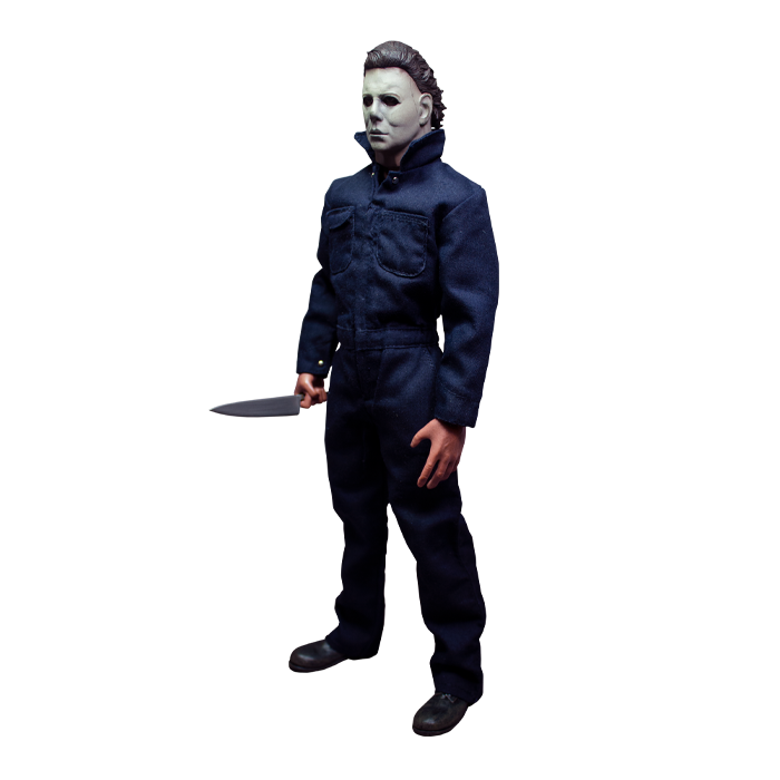 This is a Halloween 1978 Michael Myers action figure and he has a white face, brown hair, blue coveralls and he is holding a silver knife while turned to the right.