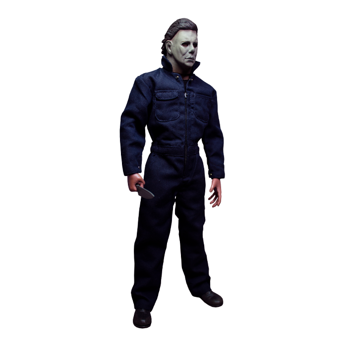 This is a Halloween 1978 Michael Myers action figure and he has a white face, brown hair, blue coveralls and he is holding a silver knife while turned to the left.