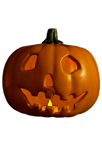 This is a Halloween 1978 pumpkin prop that is orange with a green stem and the pumpkin is smiling and has a light in it.