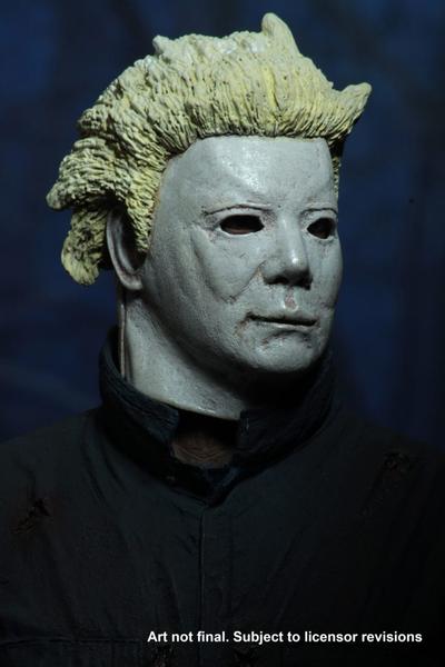 This is a Halloween II Michael Myers NECA action figure and he is wearing a white Ben Tramer mask with yellow hair, with green blue coveralls..