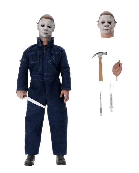 This is a neca Halloween II Michael Myers action figure and he has a white mask, green coveralls, a white mask with blood tears, a knife, a hammer and a scalpel.