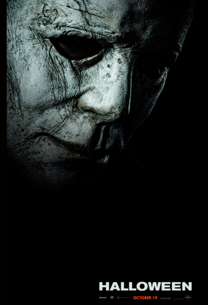 This is a Halloween 2018 Michael Myers poster with a mask that is weathered grey face and has the word Halloween on it.
