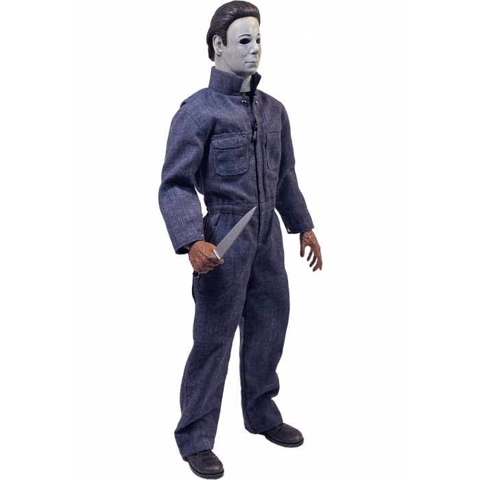 This is a Halloween 4 Return of Michael Myers Trick Or Treat Action Figure and he has a white mask, blue coveralls, black boots, burnt hand that are holding a silver knife.