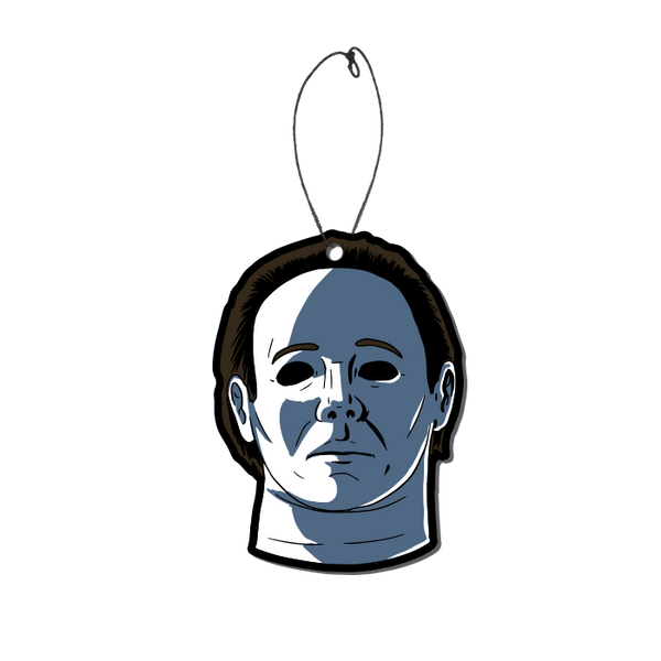 This is a Halloween 4 Return of Michael Myers air freshener and he has a white face, brown hair and black eyes.